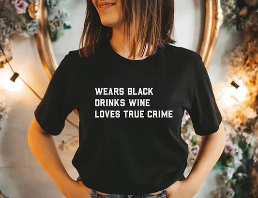 Wears black drinks wine loves true crime shirt| true crime shirt| true crime gift| true crime lover